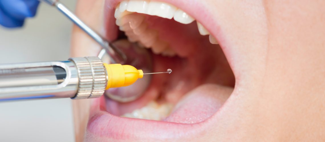 Dental anesthetic. Close-up, focus on syringe